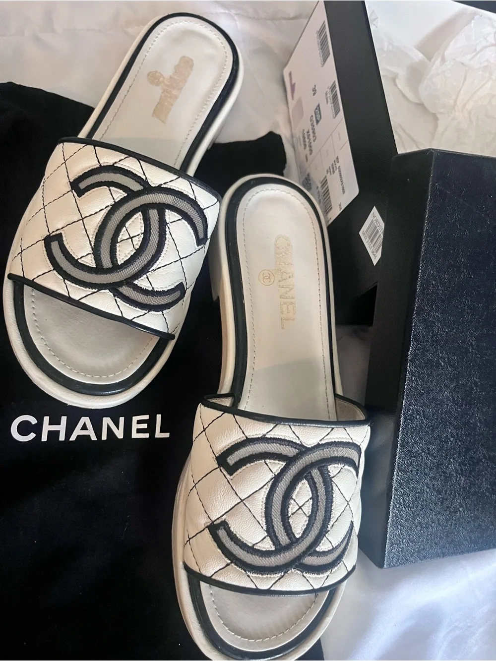 CHANEL White Quilted Slide Sandals with Black Logo Trim